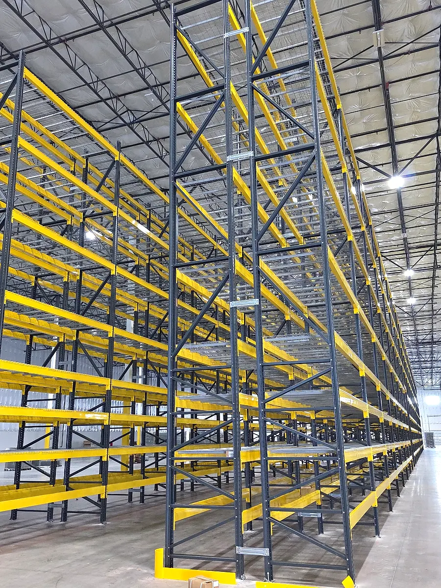 Tall engineered pallet rack aisle installed by Alliance