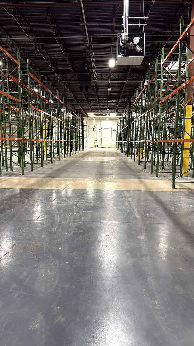 Looking down a finished pallet rack aisle