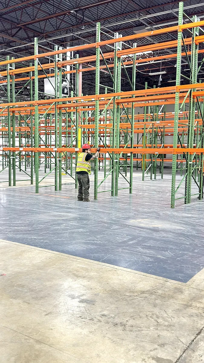 Crew working down a new pallet rack row